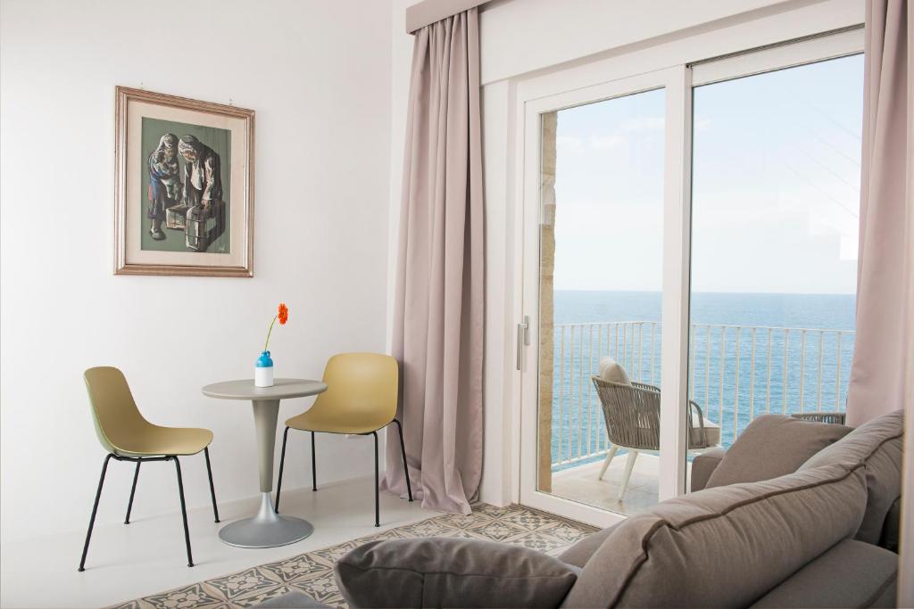 a living room with a couch and a table at Dimora Talenti in Polignano a Mare