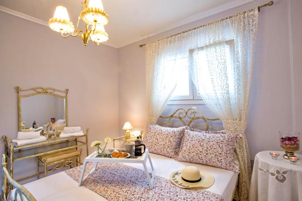 Postel nebo postele na pokoji v ubytování Golden Suites