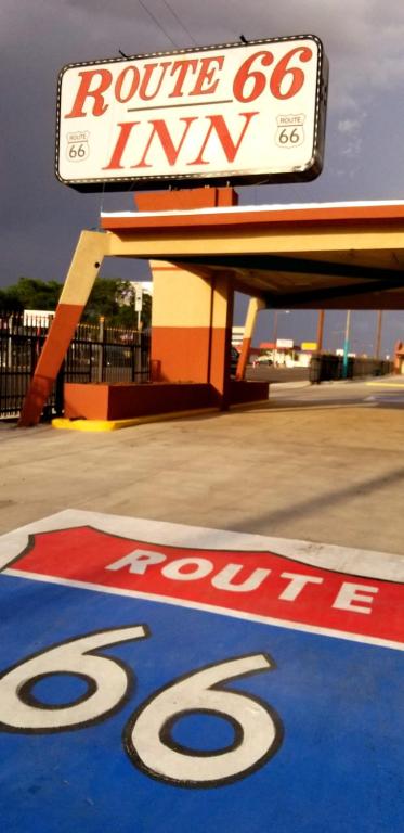 a route sign on the ground in front of a store at Route 66 Inn in Amarillo