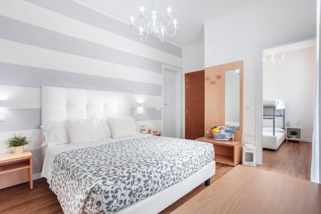 Postel nebo postele na pokoji v ubytování Hotel Geminus B&B