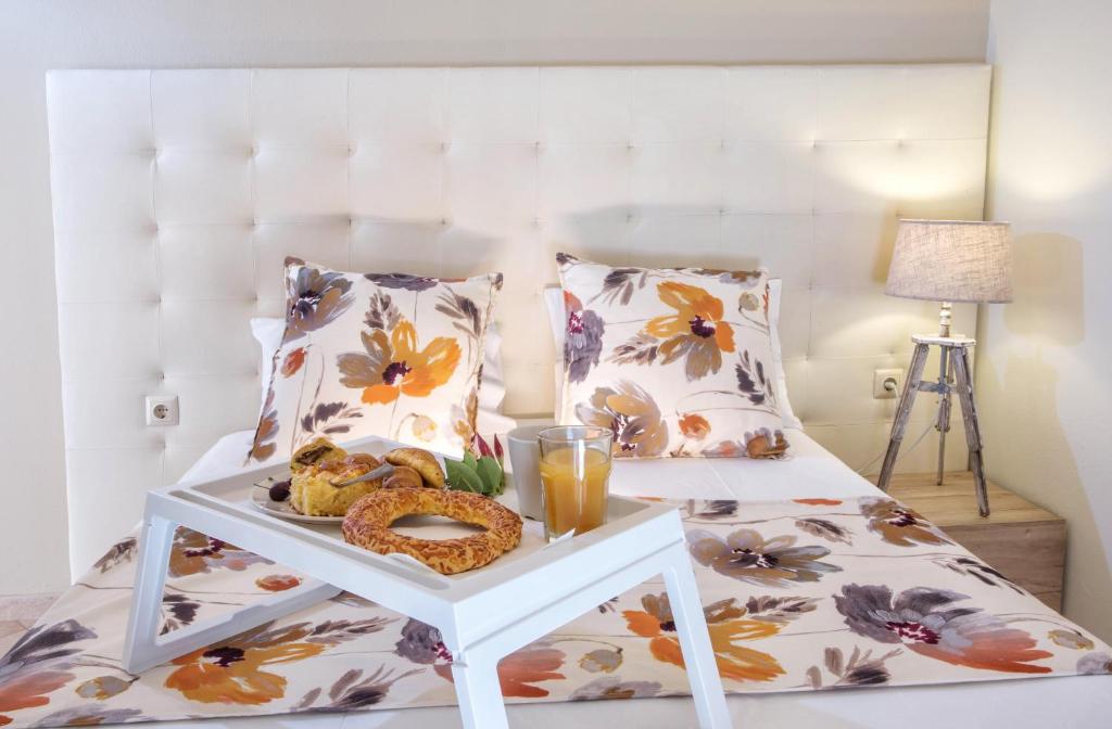 Postel nebo postele na pokoji v ubytování Golden Suites