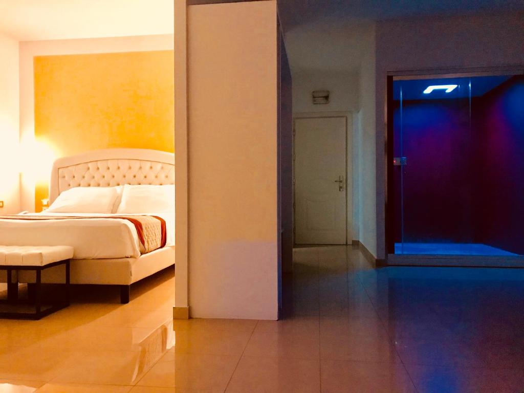 Postel nebo postele na pokoji v ubytování Hotel Verdi