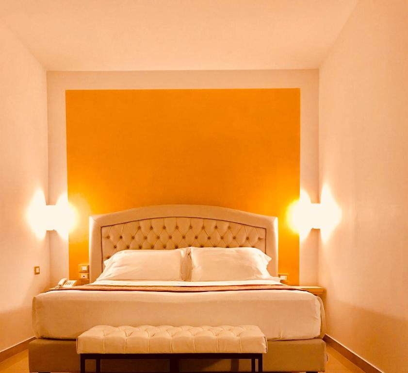 Postel nebo postele na pokoji v ubytování Hotel Verdi