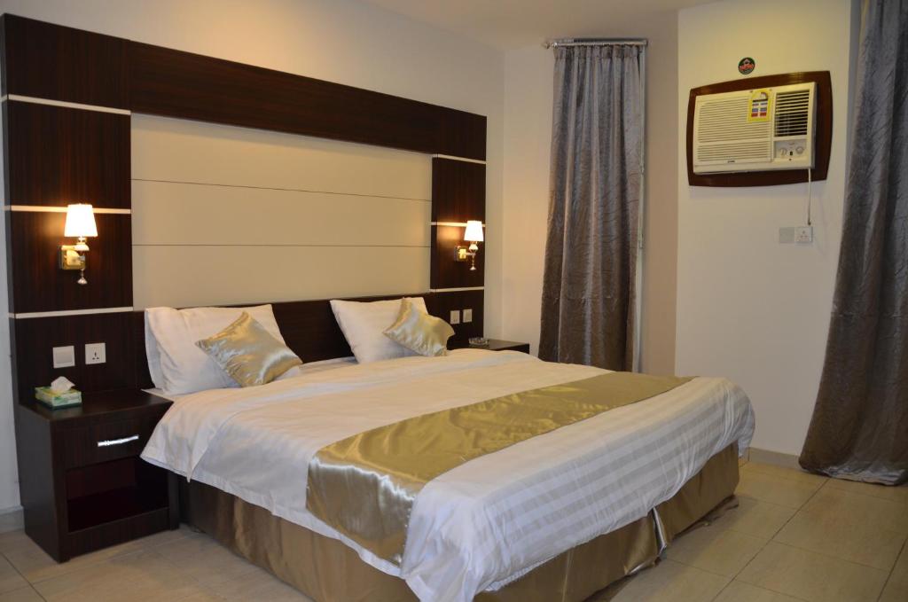 Postel nebo postele na pokoji v ubytování Jazan Heart Hotel