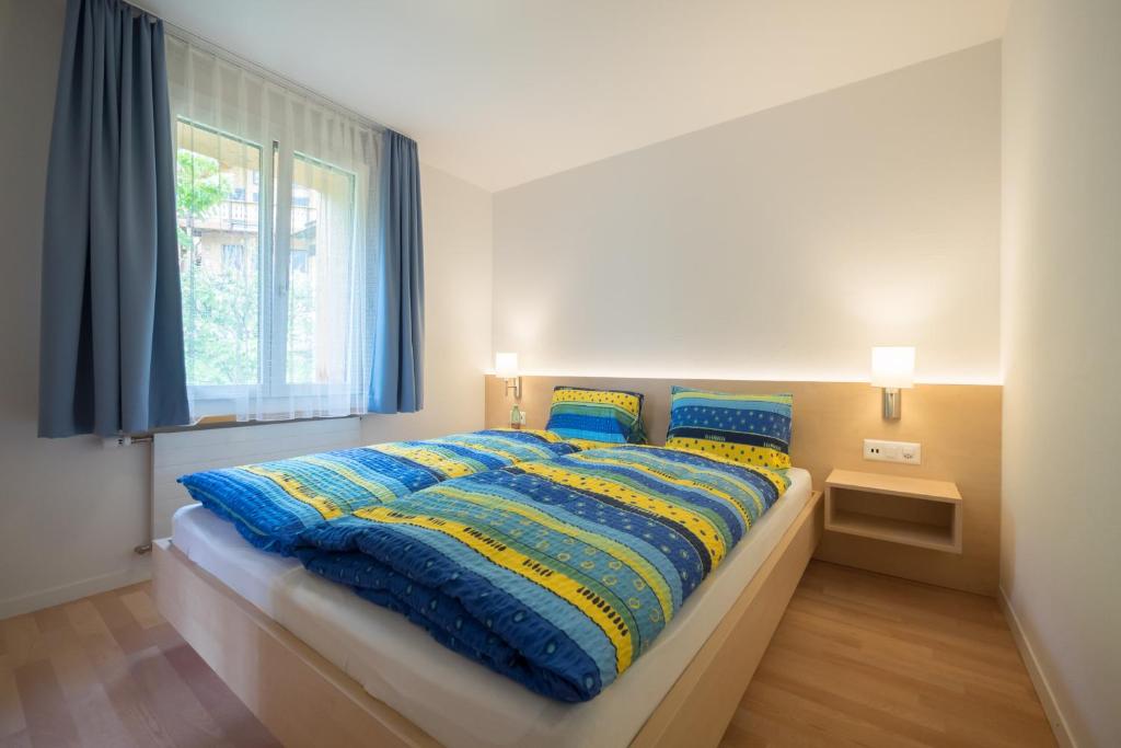Postel nebo postele na pokoji v ubytování Hotel Alpenblick Mürren