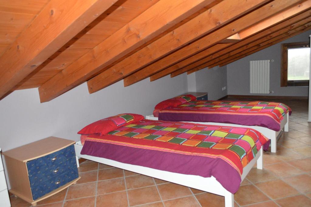 Postel nebo postele na pokoji v ubytování Il Melograno b&b Apartament