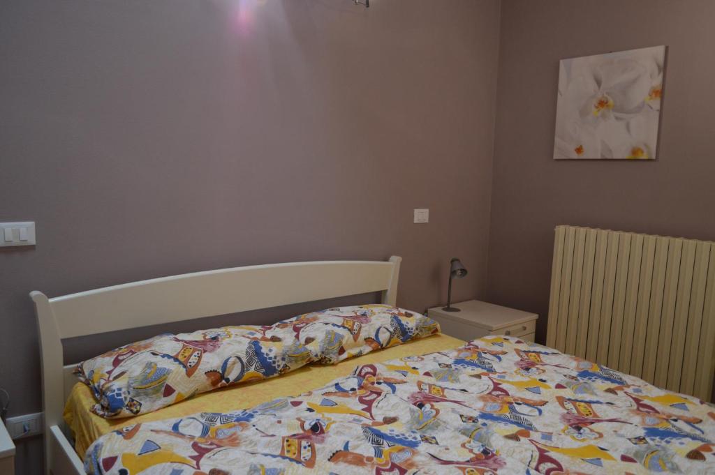 Postel nebo postele na pokoji v ubytování Il Melograno b&b Apartament