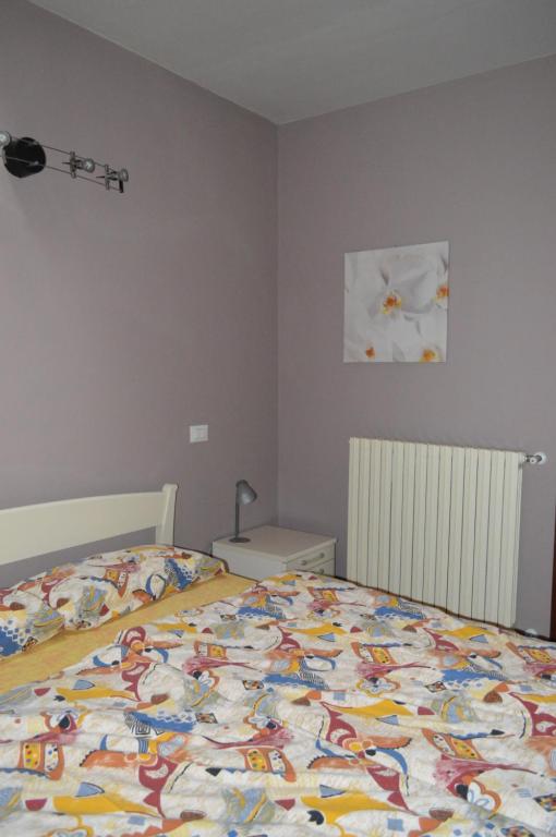 Postel nebo postele na pokoji v ubytování Il Melograno b&b Apartament