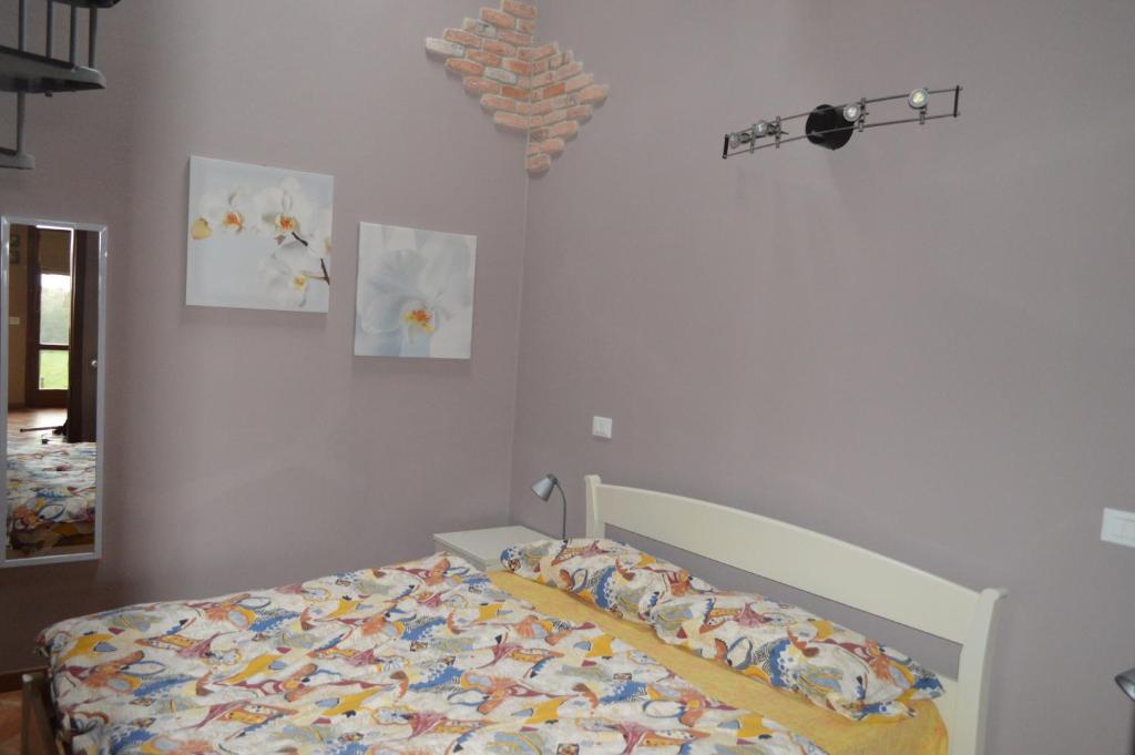 Postel nebo postele na pokoji v ubytování Il Melograno b&b Apartament