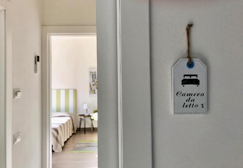 A bed or beds in a room at Gardaselle Holiday Rooms