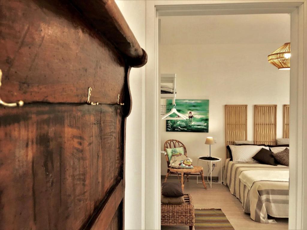 A bed or beds in a room at Gardaselle Holiday Rooms