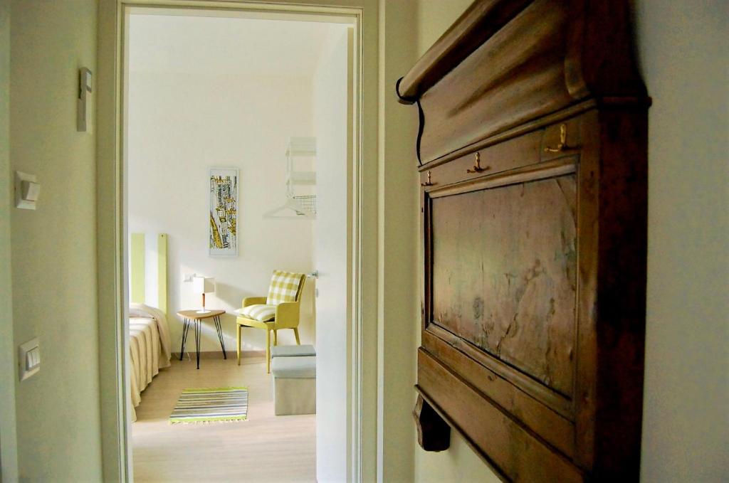 A bed or beds in a room at Gardaselle Holiday Rooms