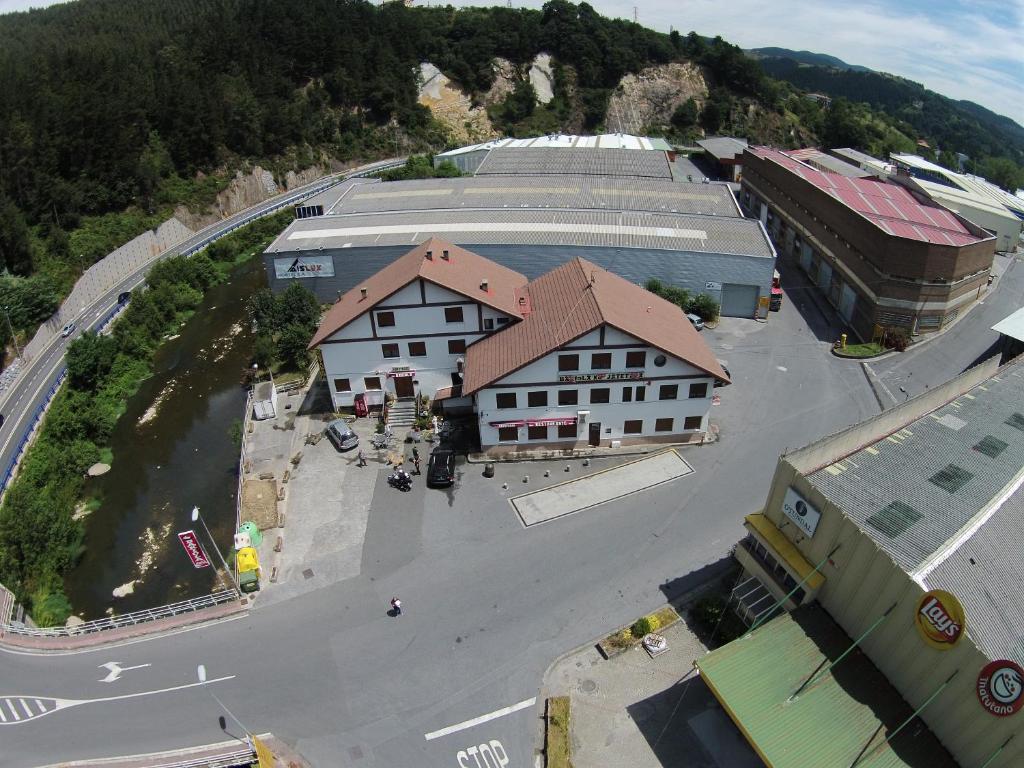 an aerial view of a town with a building at Bakiola in Arrankudiaga