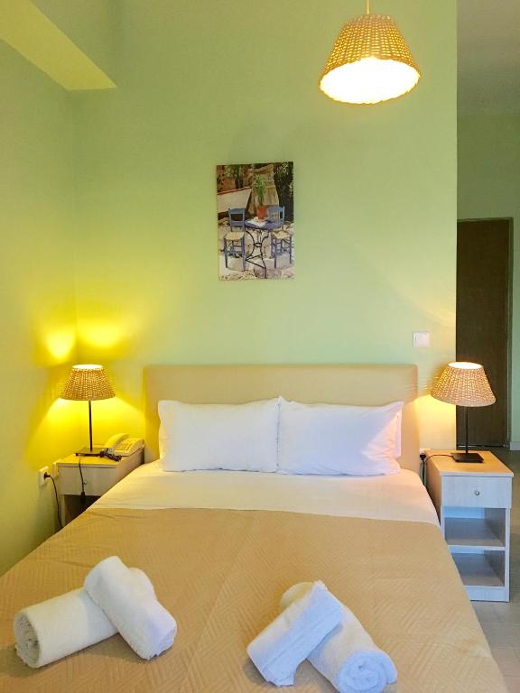 Postel nebo postele na pokoji v ubytování Venus Beach Hotel