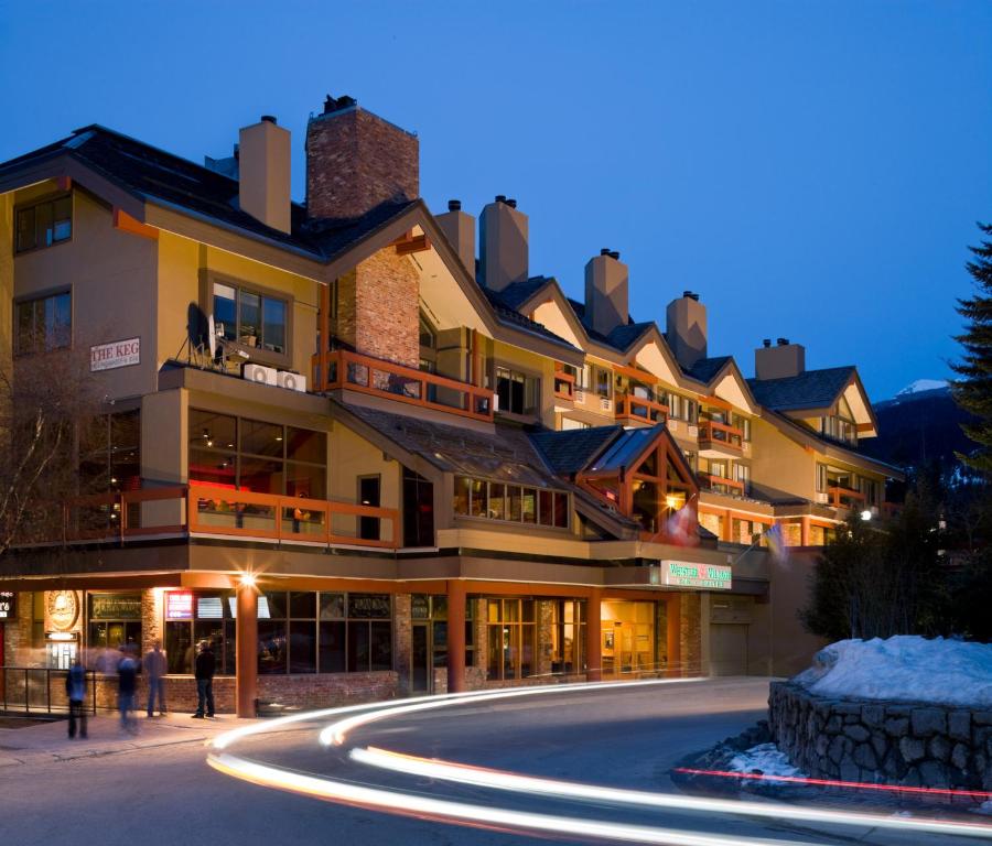 a building with a road in front of it at Whistler Village Inn & Suites in Whistler