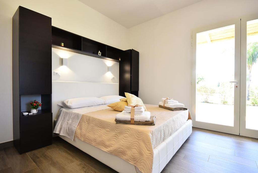Postel nebo postele na pokoji v ubytování Borgo Fiorito Relais