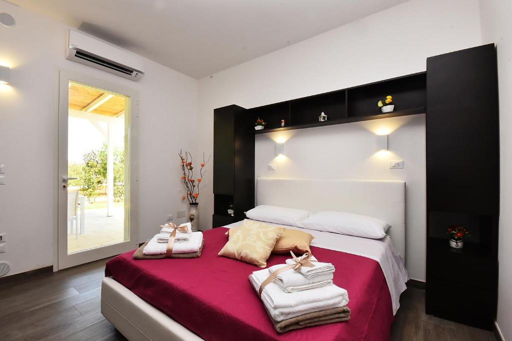 Postel nebo postele na pokoji v ubytování Borgo Fiorito Relais