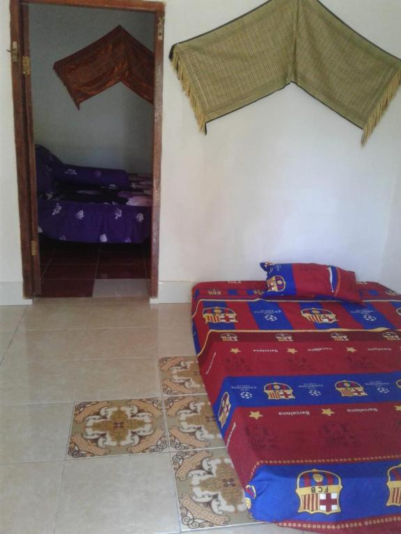 Postel nebo postele na pokoji v ubytování Crispycool Homestay