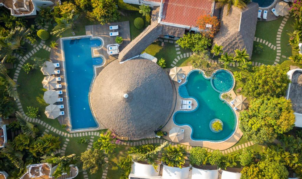 an aerial view of a resort with a pool at Navutu Dreams Resort & Wellness Retreat in Siem Reap