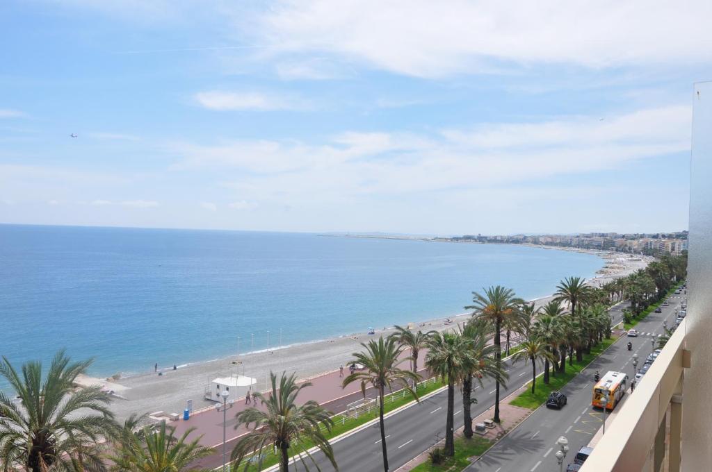 a view of a beach and the ocean from a building at Sea View Astrella in Nice