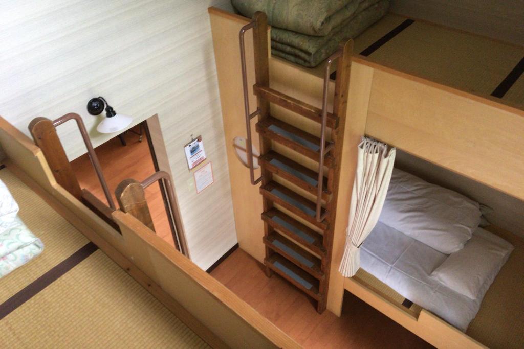 Postel nebo postele na pokoji v ubytování Niseko Tabi-tsumugi Backpackers