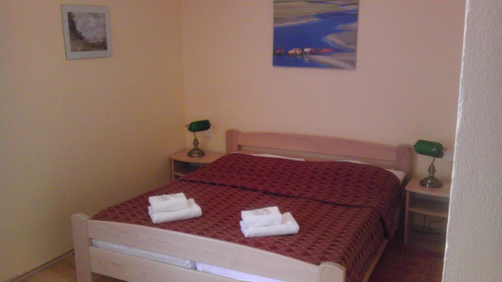Postel nebo postele na pokoji v ubytování Grand Hotel