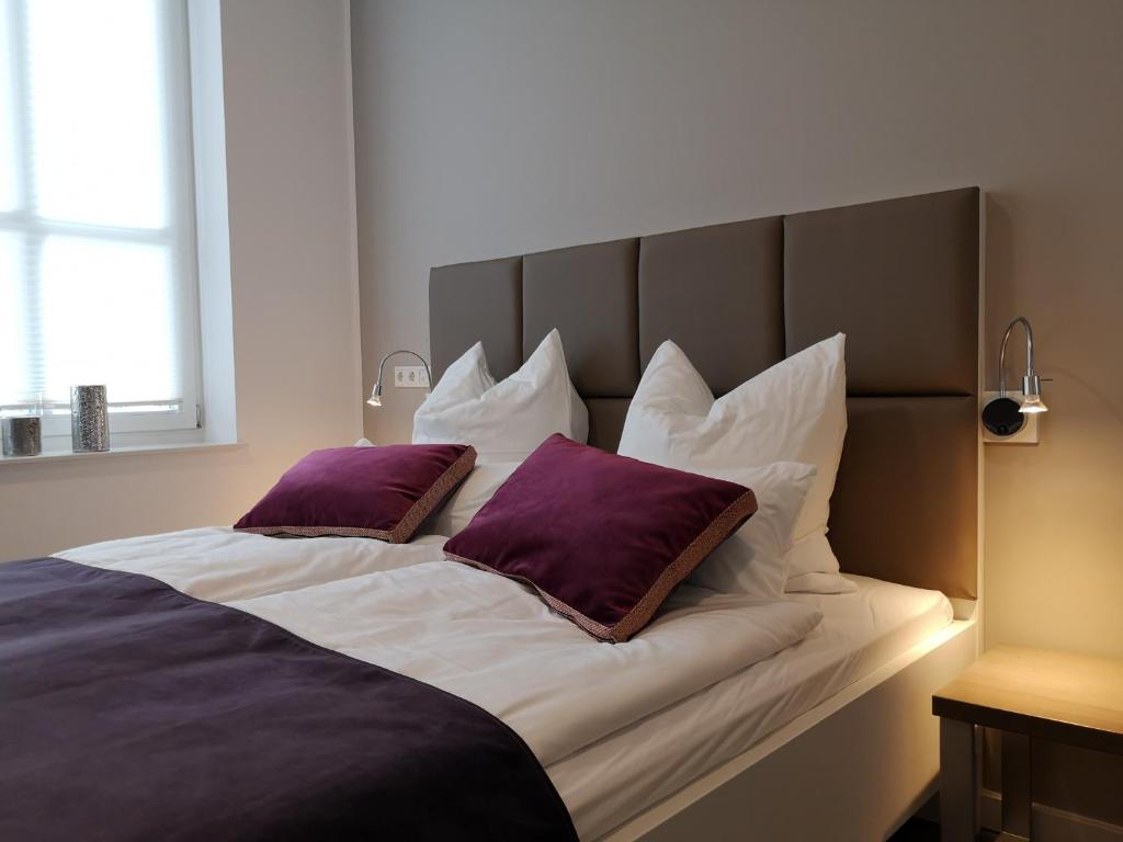 Postel nebo postele na pokoji v ubytování Trip Inn PostApart Aschaffenburg