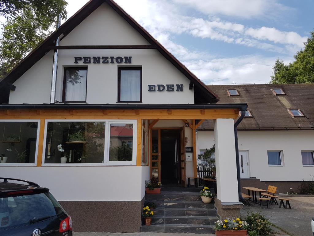 a building with a sign that reads pensionerben at Penzion Eden Turnov in Turnov