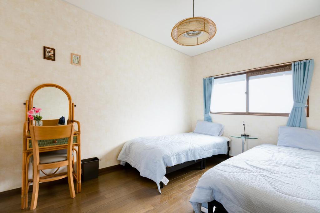 Postel nebo postele na pokoji v ubytování A&Z Guest House 関空行南海線二色の浜駅三分 鍵付き4人部屋