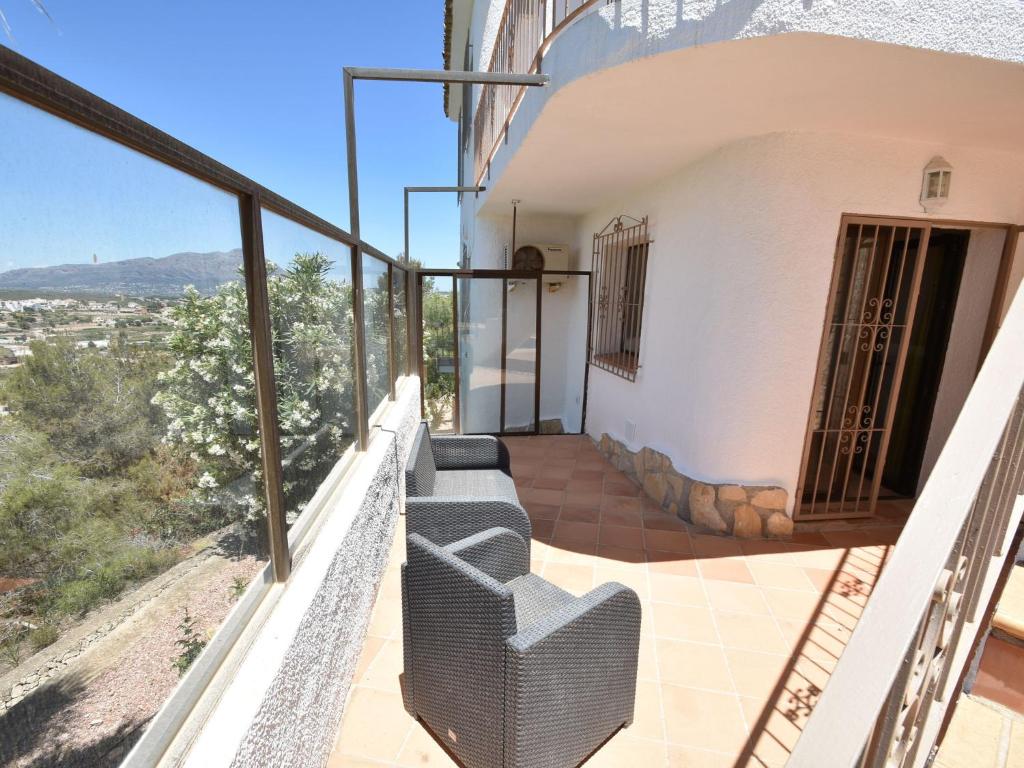 A balcony or terrace at Villa with private pool in Benitachell