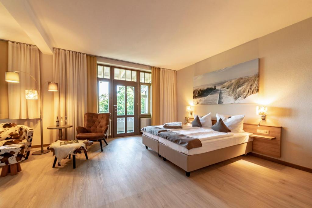 Postel nebo postele na pokoji v ubytování Hotel Villa Halliger