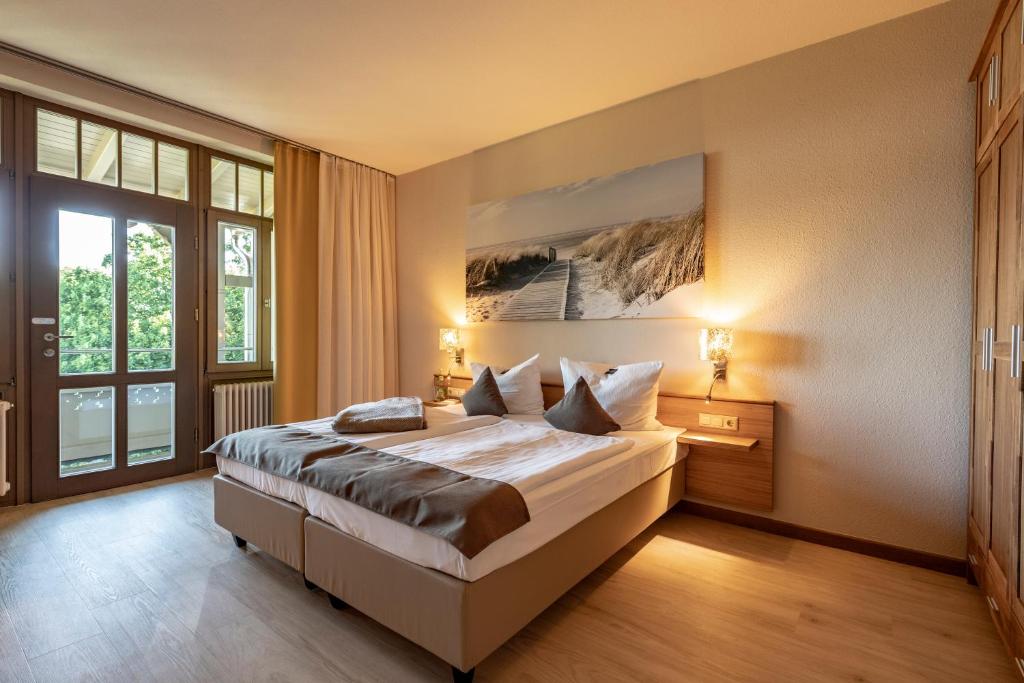 Postel nebo postele na pokoji v ubytování Hotel Villa Halliger