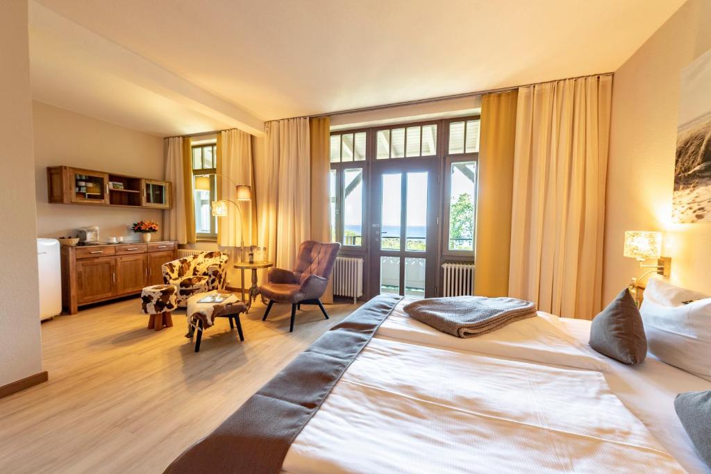 Postel nebo postele na pokoji v ubytování Hotel Villa Halliger