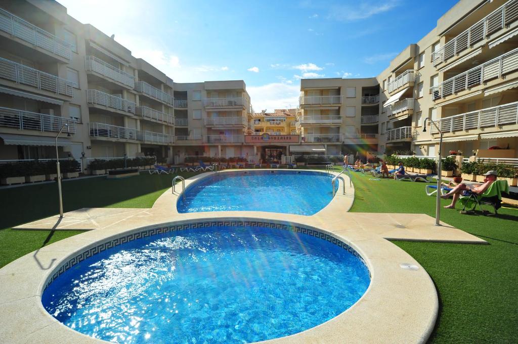a large swimming pool in the middle of a building at Cala Gonzalez Superior Orange Costa in Alcossebre