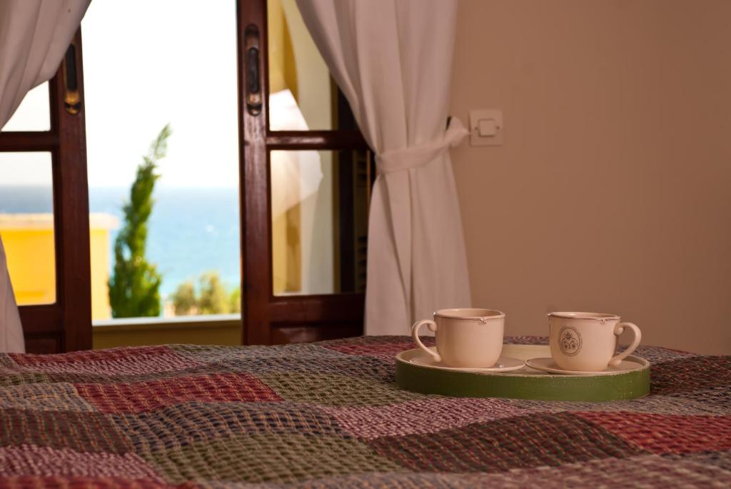 Postel nebo postele na pokoji v ubytování Amboula Beach Apartments