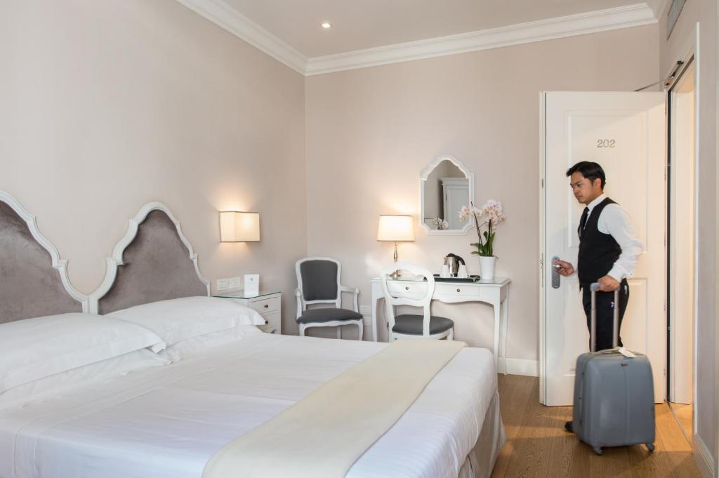 Postel nebo postele na pokoji v ubytování Hotel Rapallo