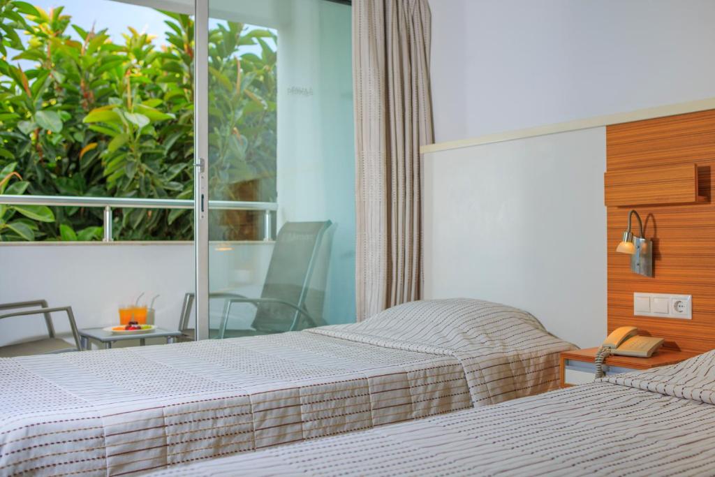 Postel nebo postele na pokoji v ubytování Hotel Delta
