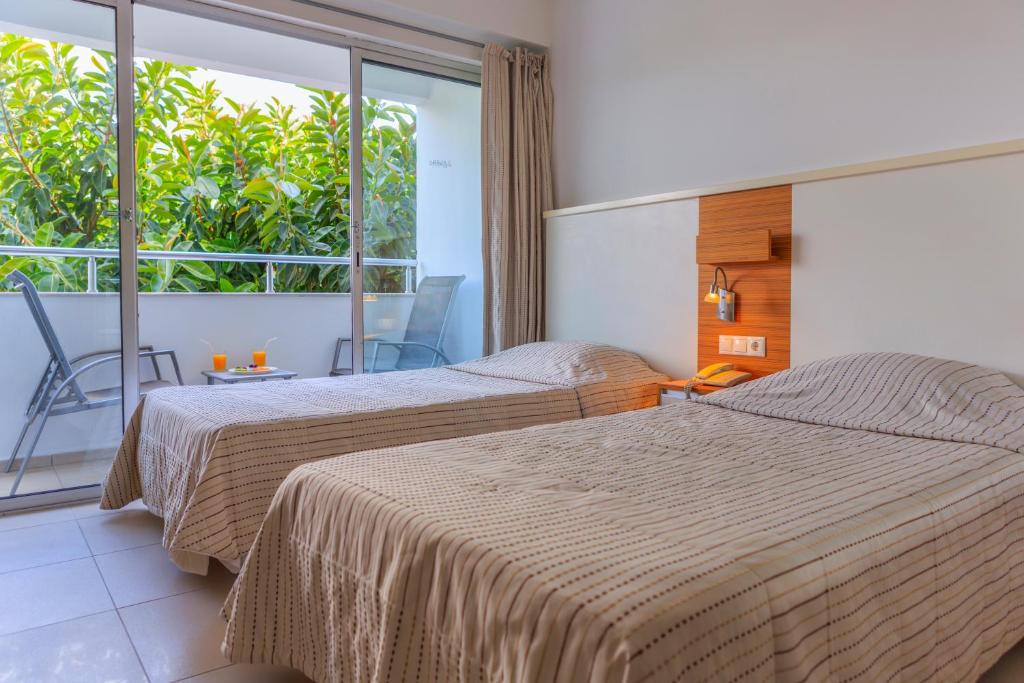 Postel nebo postele na pokoji v ubytování Hotel Delta