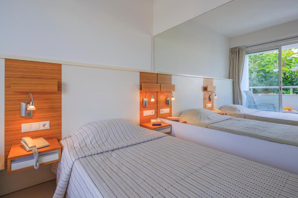 Postel nebo postele na pokoji v ubytování Hotel Delta