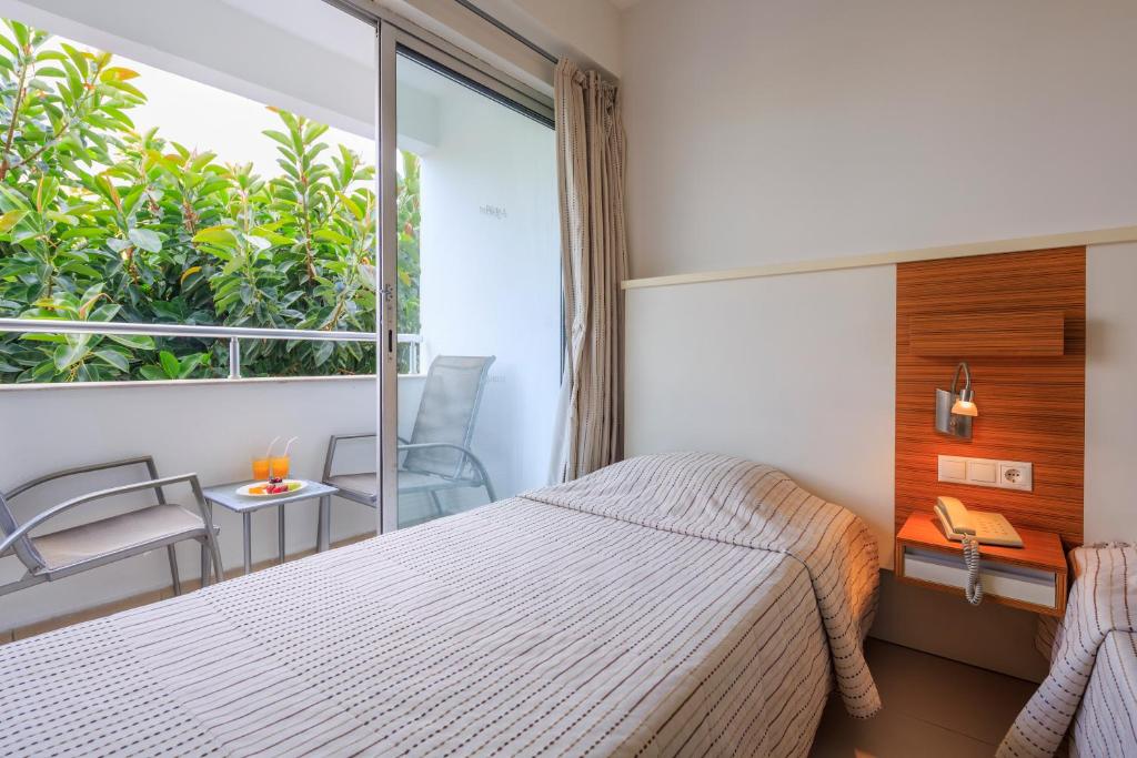 Postel nebo postele na pokoji v ubytování Hotel Delta