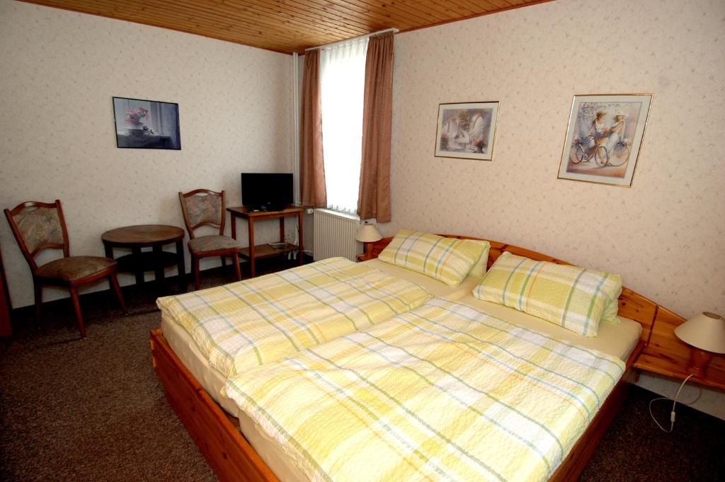 Postel nebo postele na pokoji v ubytování Wiedaer Hütte