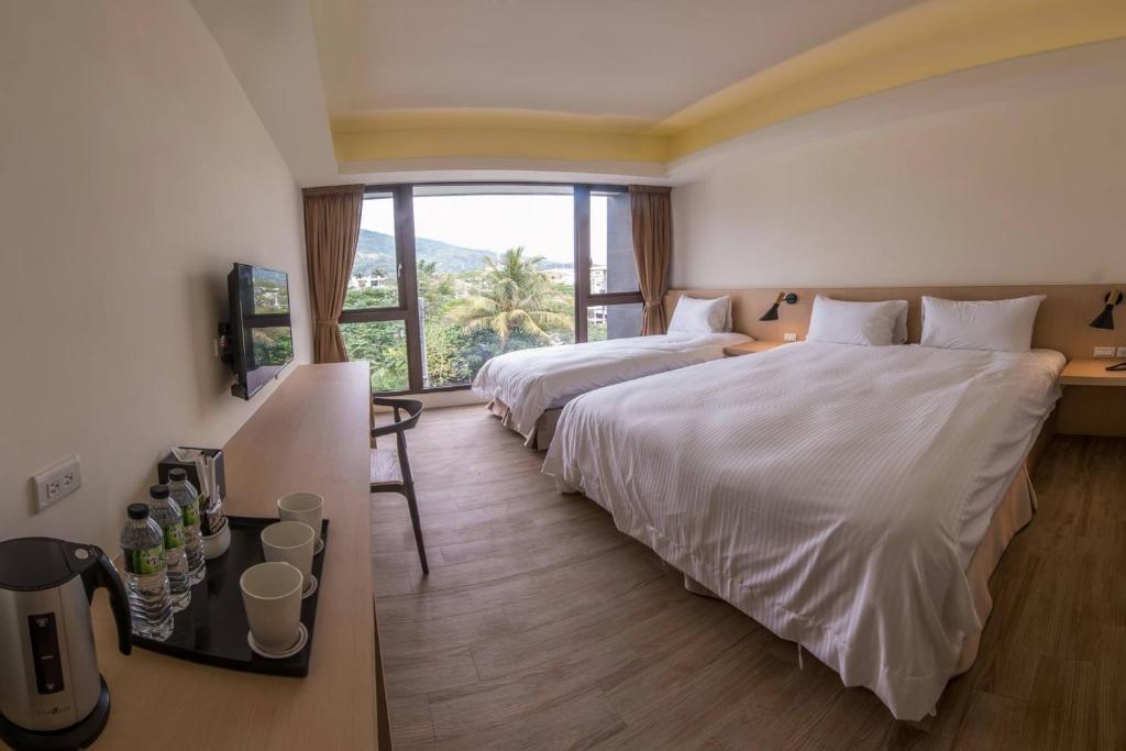 Postel nebo postele na pokoji v ubytování KET Hotel