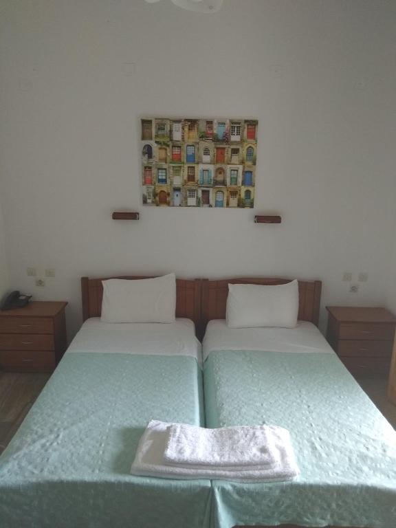 A bed or beds in a room at Oasis