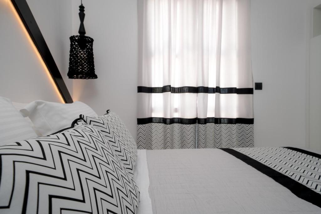 Postel nebo postele na pokoji v ubytování Divelia Hotel