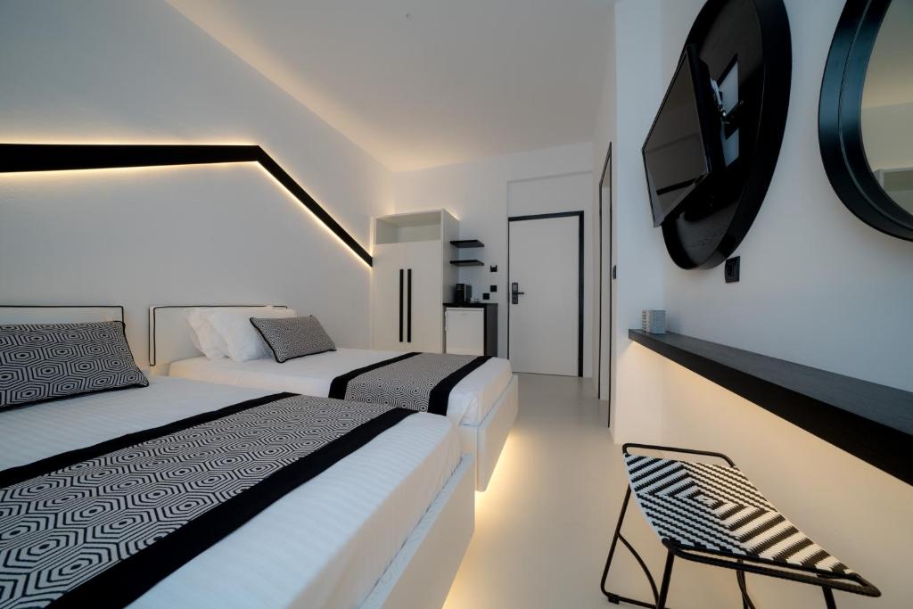 Postel nebo postele na pokoji v ubytování Divelia Hotel