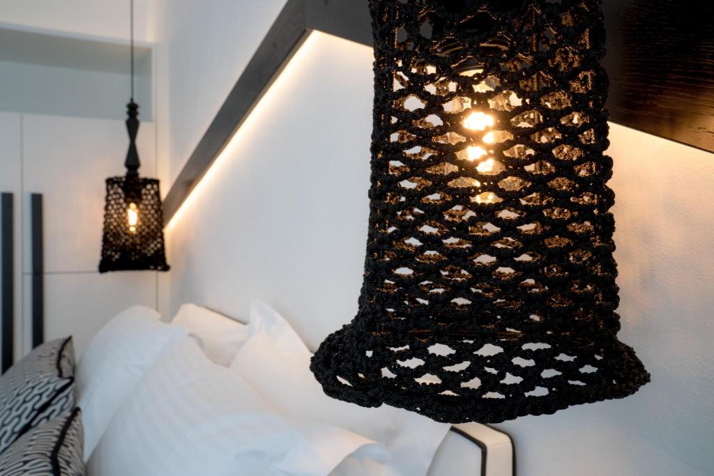 Postel nebo postele na pokoji v ubytování Divelia Hotel