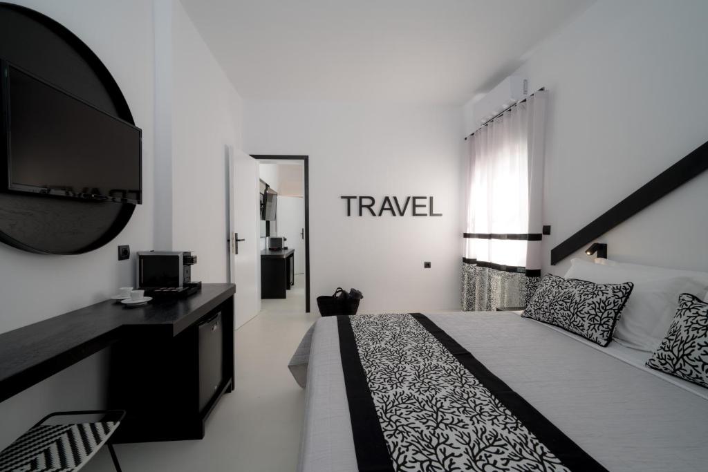 Postel nebo postele na pokoji v ubytování Divelia Hotel
