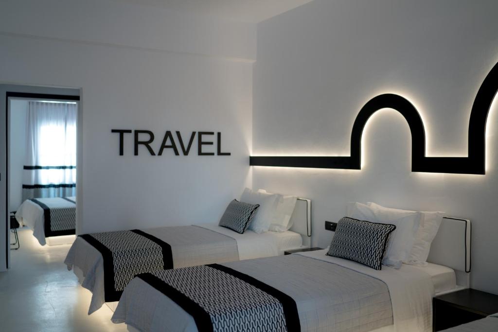 Postel nebo postele na pokoji v ubytování Divelia Hotel