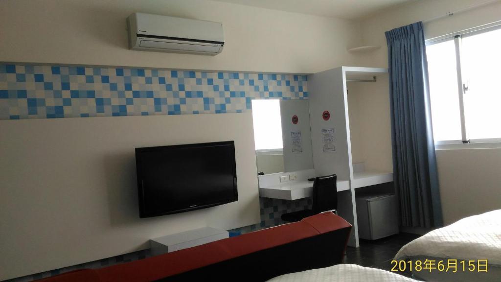 TV a/nebo společenská místnost v ubytování SKY square Homestay