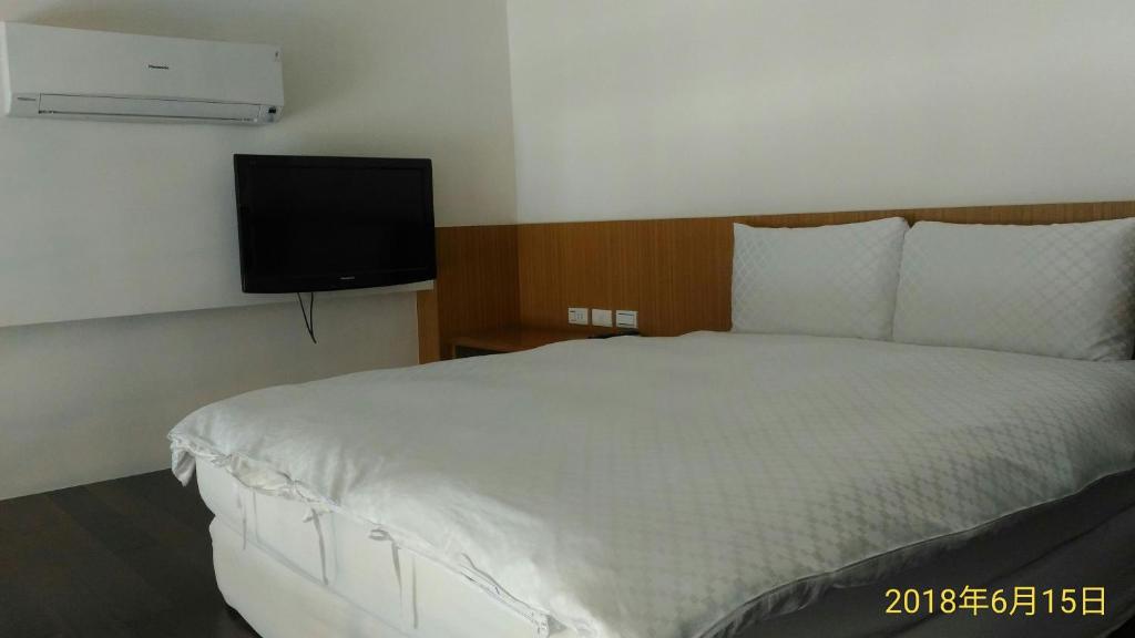 Postel nebo postele na pokoji v ubytování SKY square Homestay